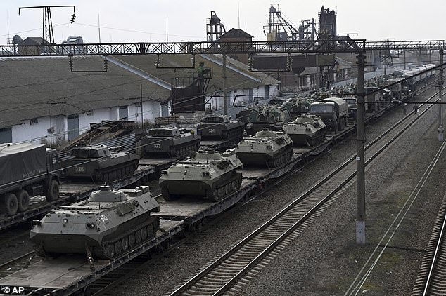 Russian armored vehicles loaded on railway platforms at the Rostov-on-Don railway station, not far from the Russian-Ukrainian border, on Wednesday