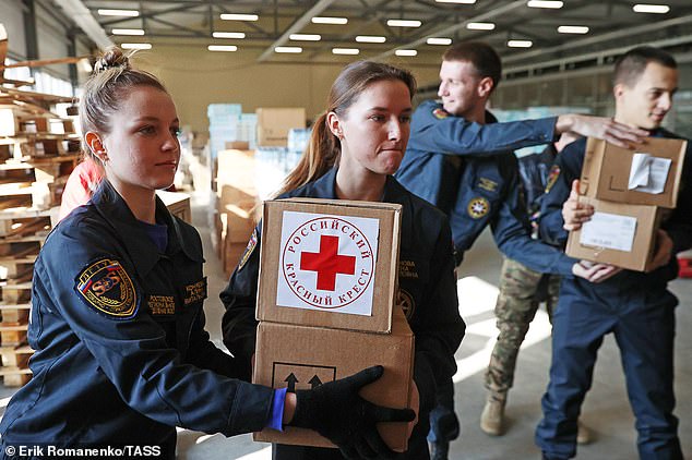 Russian volunteers carry medical supplies to a warehouse in the town of Taganrog, near the border with Ukraine, after Biden warned that blood was being transported to the front line in what is considered one of the last moves before the attack