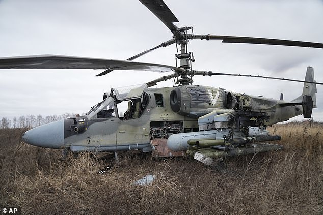 Ukrainian forces say they shot down at least four Russian KA-52 Alligator attack helicopters during a battle for Gostomel Air Base.  Fifth helicopter (pictured) was forced to make an emergency landing in the field under heavy fire