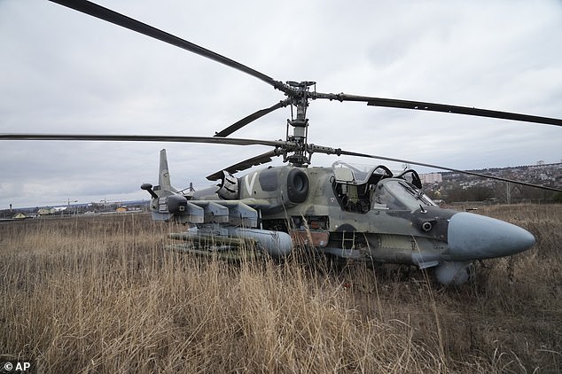 Russian Ka-52 combat helicopter seen in the field after forced landing Kiev, Ukraine