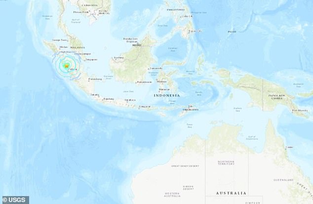 The quake struck about 12 kilometers below the Earth's surface, damaging buildings and panicking people on the island of Sumatra and neighboring Malaysia and Singapore.