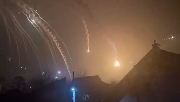 Shells are seen falling from the sky over Kiev in the early hours of Friday