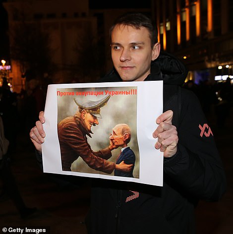 Moscovites with placards reading "No war. Putin, go away" and comparing him to Hitler walked the streets