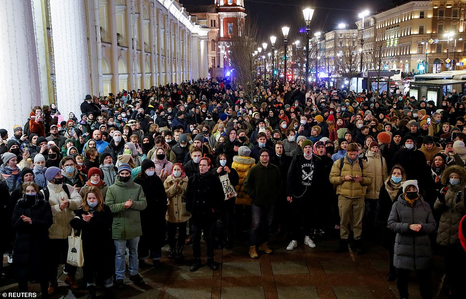 People attend an anti-war protest in President Putin's home town of St Petersburg as critics predict the invasion could lead to his downfall