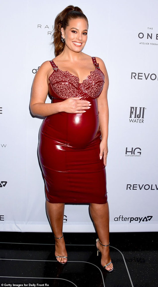 Ashley Graham shakes red latex Vex dress at the Daily Front Row's Fashion Media Awards in New York