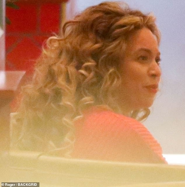 Looks great: Beyoncé wore her luxurious hair down and highlighted the siren's on-screen makeup features for her evening out in the city