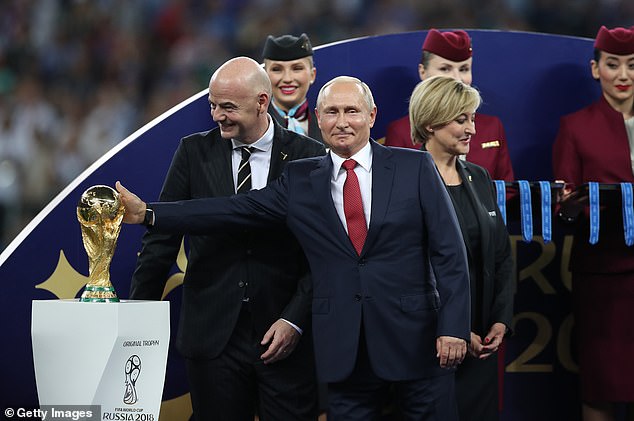 FIFA (pictured, President Gianni Infantino leaves) has suspended Russia until further notice after Russian President Vladimir Putin (center) ordered an invasion of Ukraine last week