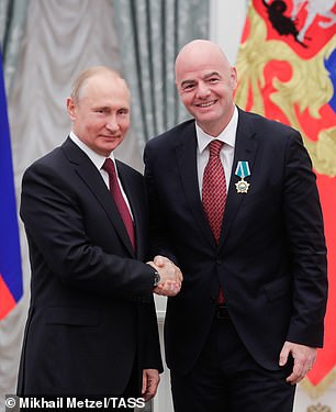 Russian President Putin (left) awards the Order of Friendship to FIFA President Infantino during a ceremony in 2019.