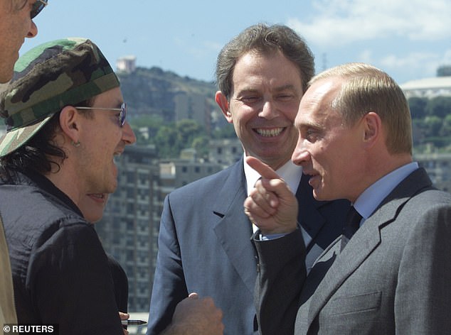 Bono (left) met Putin in 2001, along with Tony Blair, during a campaign to write off the debt of the world's poorest country.