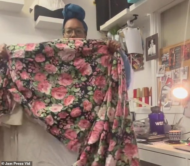 Burlesque artist Sophie shows off floral curtains she found at a thrift store before transforming them into a dress.