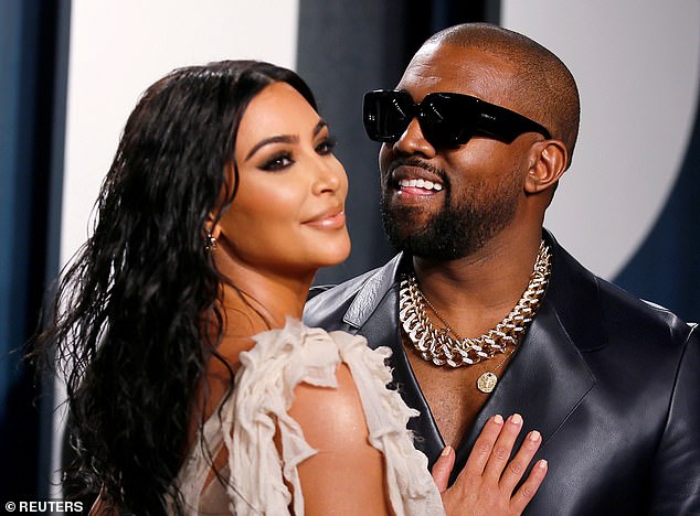 Happy times: The 43-year-old rapper is currently going through a divorce from wife Kim (pictured in 2020)