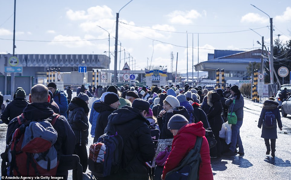 Ukrainian refugees line up in Chernivtsi March 9 to leave their home due to a Russian attack.