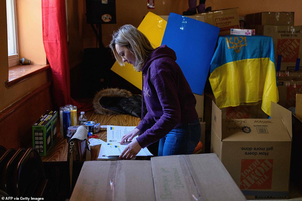 Volunteer packing donations to be sent to Ukraine at Brighton Beach