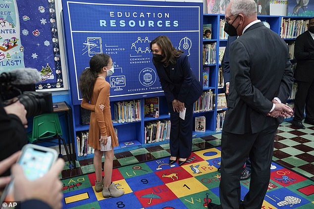 Prior to speaking, Harris spoke to a student at the Armand J. Brinkhouse Public Library in Sunset, Louisiana on Monday, March 21, 2022, with Democratic Gov. John Bel Edwards standing to the right.