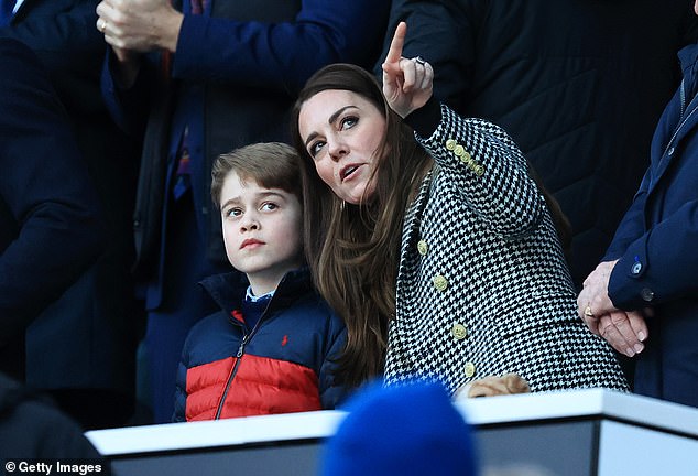 Speaking at an engagement party in Belize last night, William, 39, explained that eight-year-old George puts a pin at every destination on the world map.  Above: George with Kate at a Six Nations game last month.