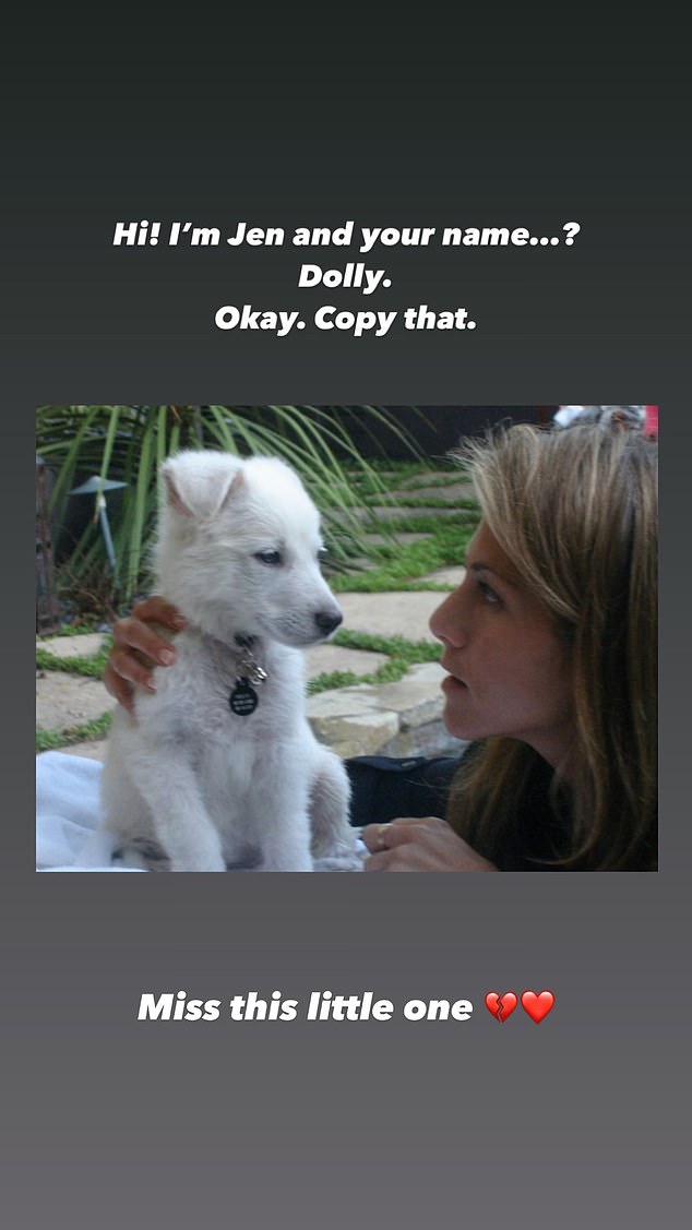 Cuteness overload: In one photo, Jen has her hand on Dolly as she texts, “Hi!  I'm Jen, and your name is...?  Dolly, okay.  Copy it'