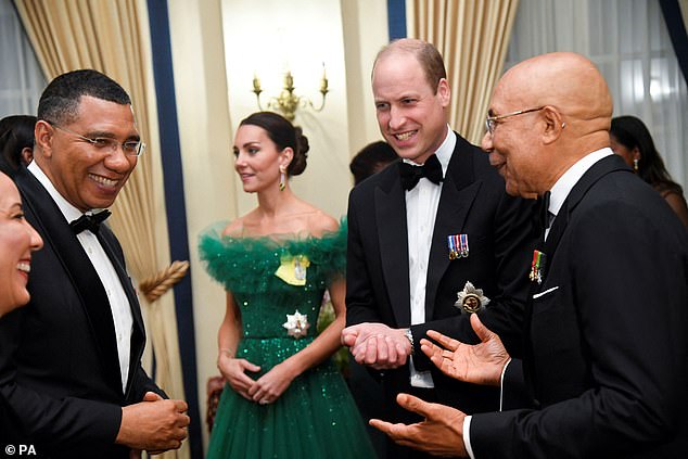 The Duke and Duchess of Cambridge (center) chat with Jamaican Prime Minister Andrew Holness (left) and Jamaican Governor General Patrick Allen (right) before dinner.