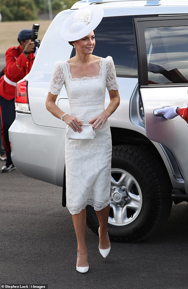 The Duchess of Cambridge stepped out in a custom-made Alexander McQueen lace gown today as she joined Prince William at the Jamaican Defense Force parade on the sixth day of their Caribbean tour.