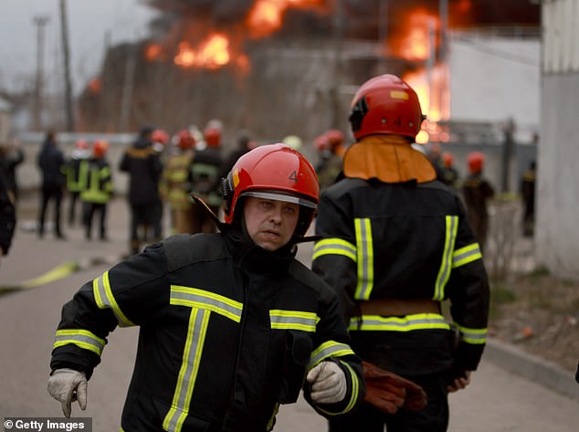 Firefighters put out a fire at an industrial facility following a Russian military attack on March 26, 2022 in Lviv, Ukraine.