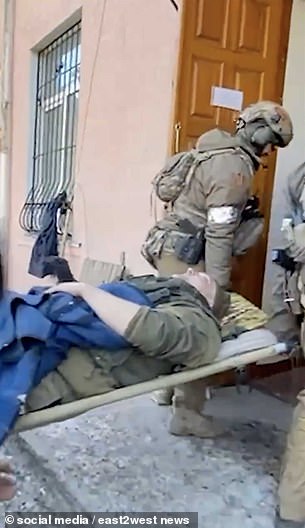 A Ukrainian journalist claimed that Medvedev (presumably pictured here lying on a stretcher in a hospital) was hit by a tank driven by his own soldier.