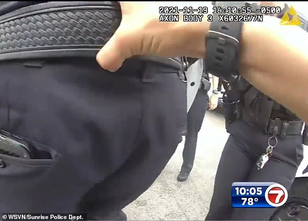 A 27-year-old police officer pulled Pullease by his belt as she tried to defuse the situation