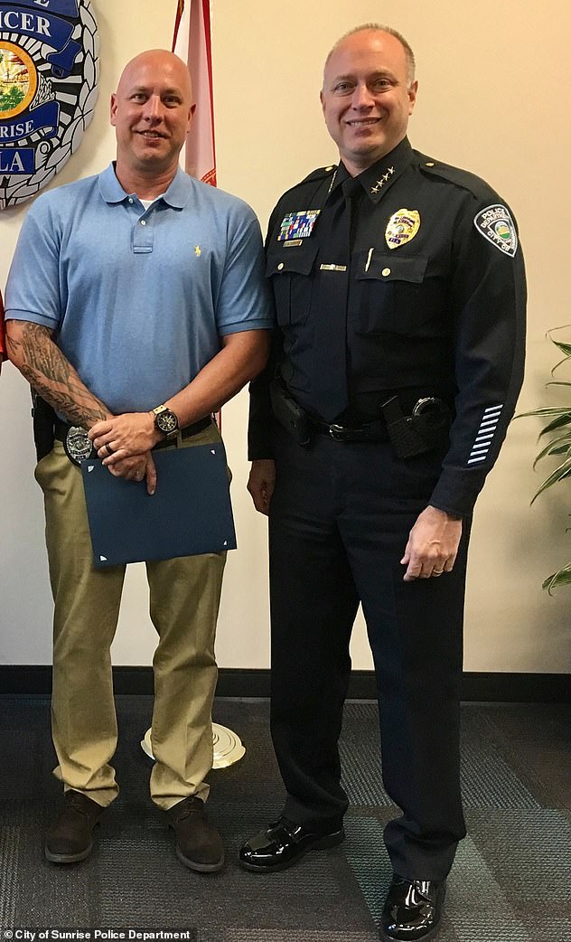 Chief Anthony Rosa (right) with Sgt. Christopher Pullease as he received an award in 2019