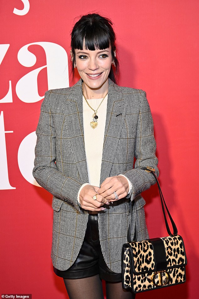 Undercover: Lily Allen looked ready for business in a gray checked blazer which she wore with a cream sweater, rear leather shorts and a leopard print Christian Dior handbag