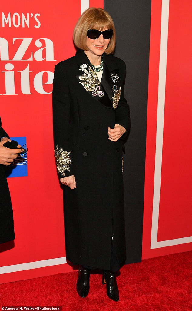 Back in black: Also causing a stir on opening night was fashion legend Anna Wintour, who looked elegant in a long black coat enlivened with beautiful gold designs