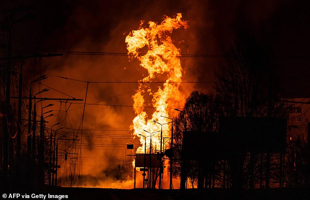 A gas station burns after Russian attacks in the city of Kharkiv March 30, 2022 amid Russia's invasion of Ukraine