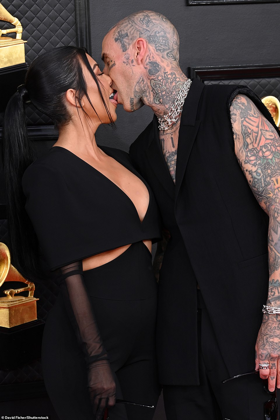 Can't be stopped: Kourtney and Travis repeated their performance at the Academy Awards a week earlier when they showed lots of tongue on the red carpet