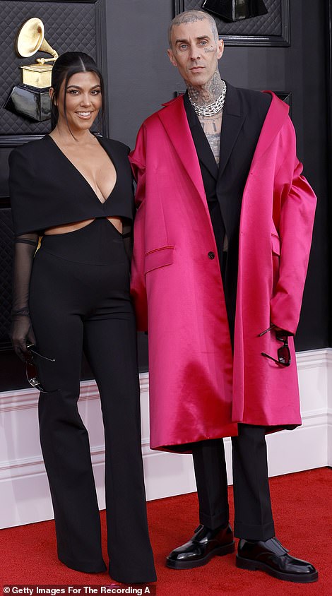 Loved up: The Poosh founder cabled that she was ready for a fun night out as she and Travis walked the Grammys red carpet in matching edgy black ensembles