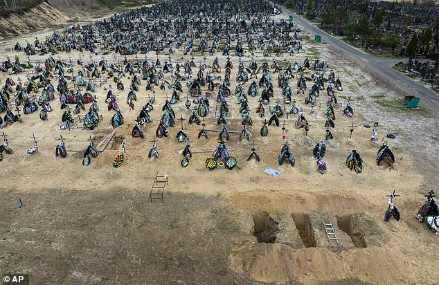 A graveyard in Irpin where three dug graves await burials after a series of attacks