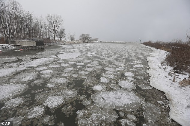 Ice cream pancakes and ice cream scoops from Lake Ontario flow into Irondequoit Bay near the Irondequoit Bay Outlet Bridge in Irondequoit, New York