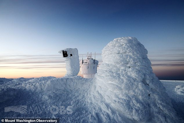 Mount Washington records wind chills of -104F - the lowest temperature ever recorded in the US - the weather observatory on the mountain is pictured shrouded in ice