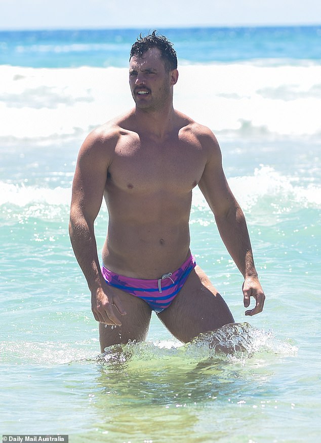 Jackson, 31, got hearts racing as he flaunted his muscular physique in a pair of purple and pink budgie smugglers