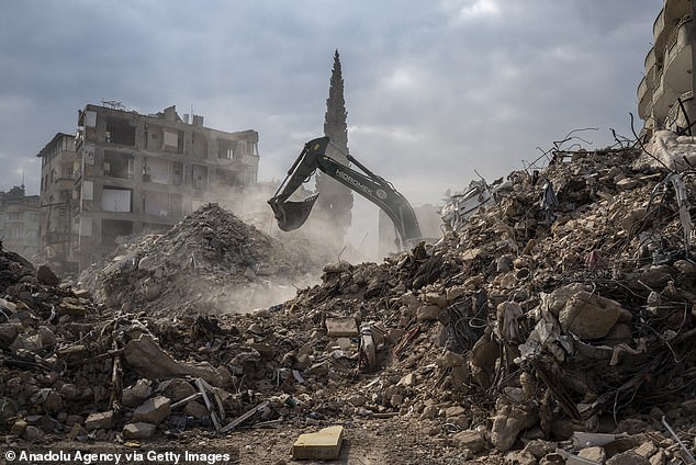 Demolition work and debris removal continues after the powerful twin earthquakes hit Hatay on February 19, 2023