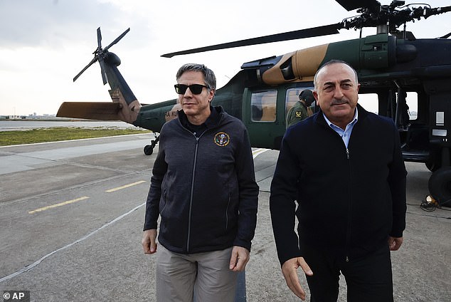 U.S. Secretary of State Antony Blinken, left, walks with Turkish Foreign Minister Mevlut Cavusoglu after a helicopter tour of the earthquake-hit areas of Hatay province Sunday, February 19, 2023, at Incirlik Air Force Base near Adana, Turkey has undertaken