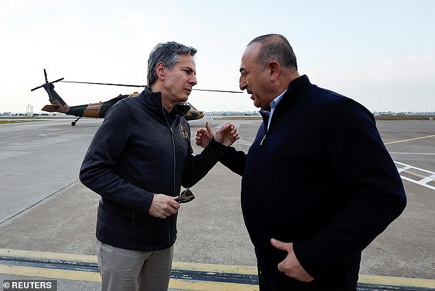 U.S. Secretary of State Antony Blinken speaks with Turkey's Foreign Minister Mevlut Cavusoglu after a helicopter tour of earthquake-hit areas of Hatay province at Incirlik Air Base near Adana, Turkey, February 19, 2023