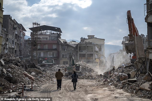 Demolition work and debris removal continues after the powerful twin earthquakes hit Hatay on February 19, 2023