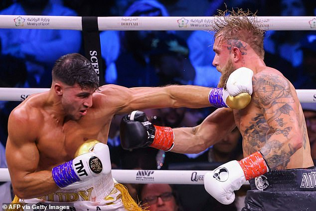 British reality TV star Tommy Fury (L) battles US YouTuber Jake Paul in a fight that has netted both millions