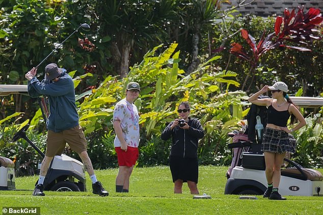 Protected from the sun: The actress wore a white hat and black sunglasses while golfing