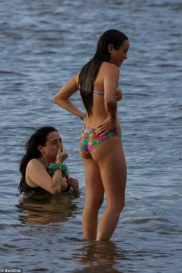 All the way: Chase completely submerged her sensational figure in the water and stepped out with her hair slicked back