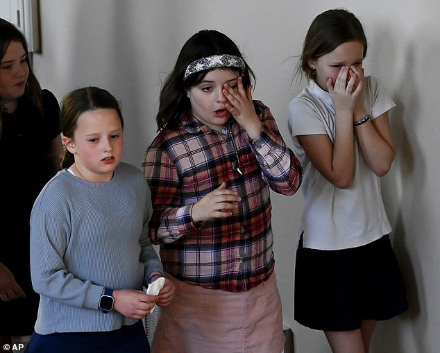 A group of girls appear heartbroken after leaving a prayer vigil at Woodmont Christian Church for the victims of a mass shooting at Covenant School