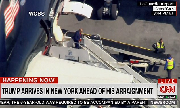 The former president steps off the plane at LaGuardia Airport after his plane landed just after 3:30 p.m. Monday