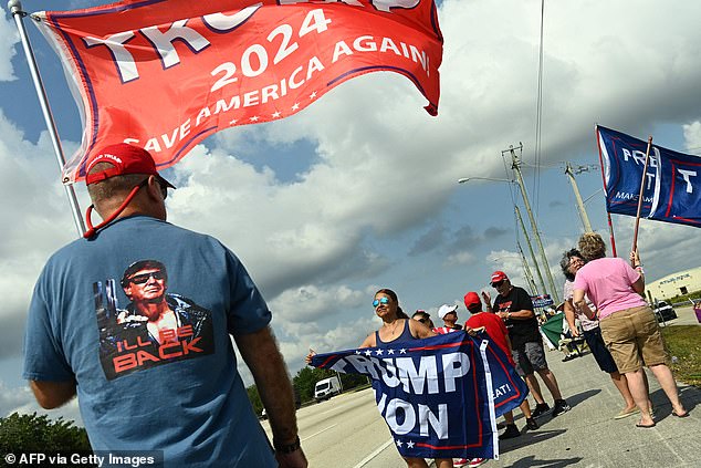 Trump supporters line the streets outside of Mar-a-Lago en route to Palm Beach International Airport, where his journey to Manhattan begins