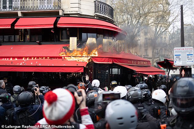 PARIS — Meanwhile in Paris, angry protesters set fire to one of Macron's favorite restaurants amid ongoing anger over his pension reform