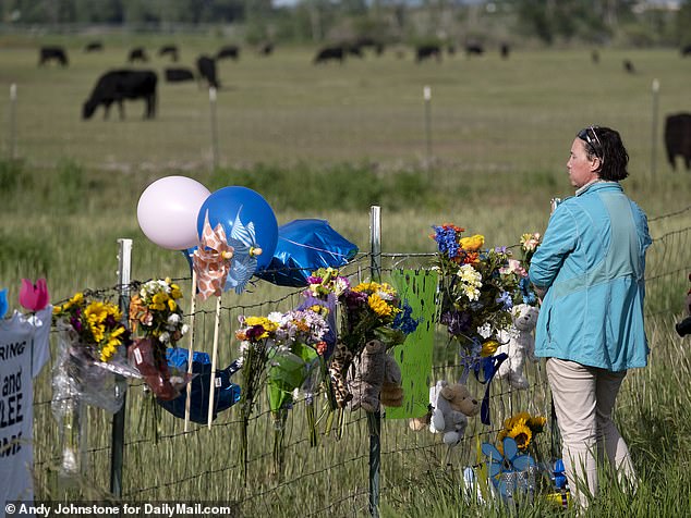 Flowers and balloons line the fence around the Salem, Idaho property of Chad Daybell, who was arrested on charges related to JJ and Tylee's disappearance