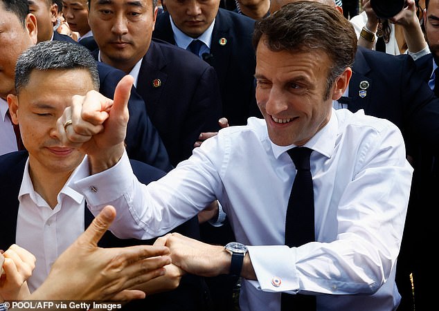 Macron is greeted as a rock star by students before