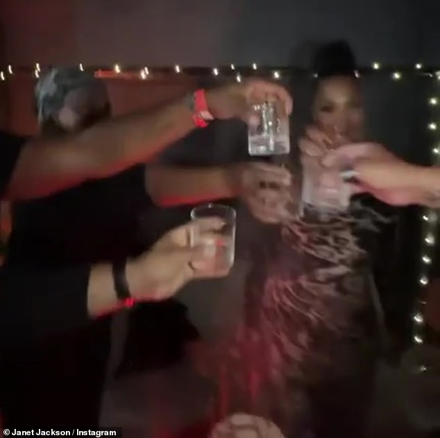 Cheers: The Rhythm Nation singer toasted her friends at her 57th birthday party