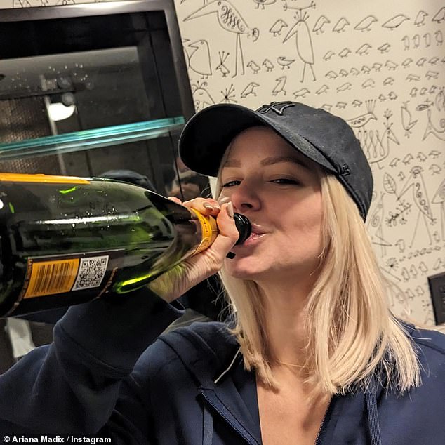 Drinking away the pain: She also shared a picture of herself drinking straight from the bottle